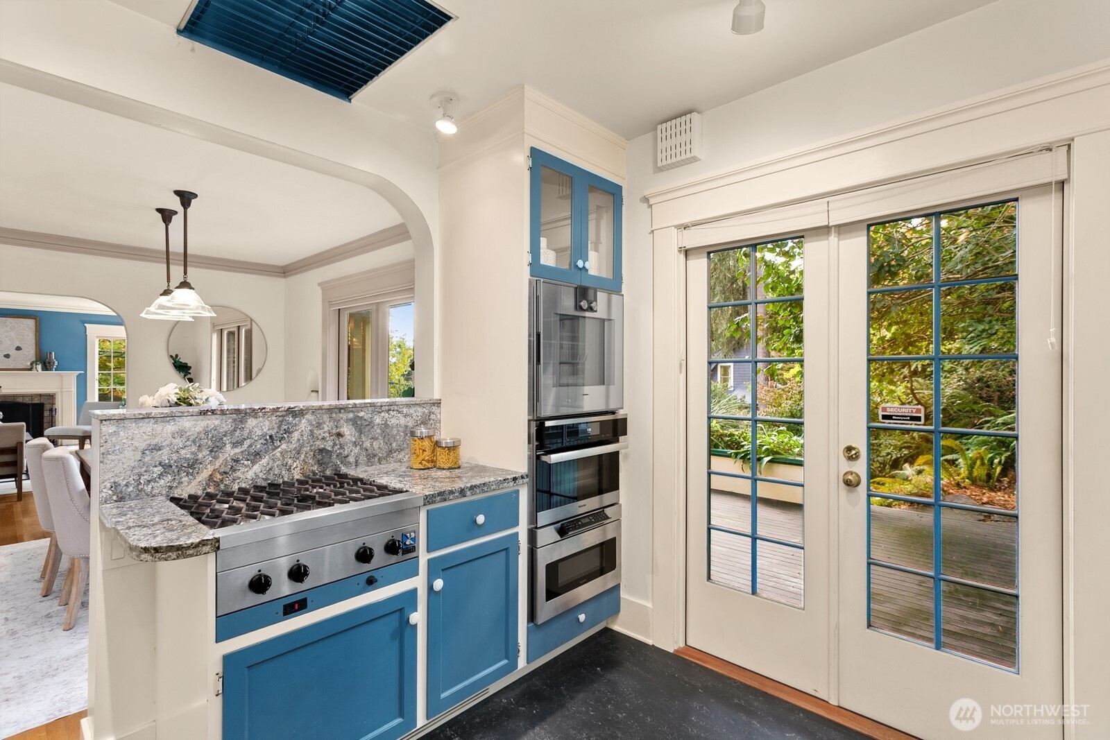 615 36th Avenue Seattle, WA 98122 - Photo 14 of 40 a kitchen with stainless steel appliances granite countertop a stove and a sink