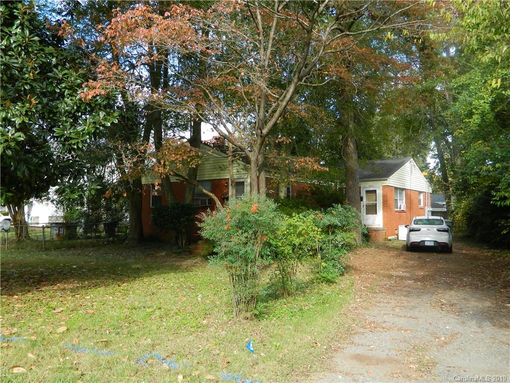 5221 Valley Stream Road Charlotte, NC 28209 - Photo 2 of 2 a view of a house with a tree in the yard