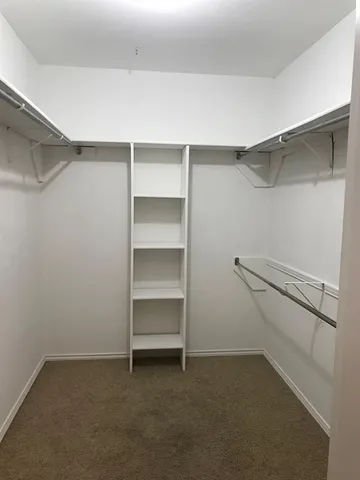 a view of an empty walk in closet