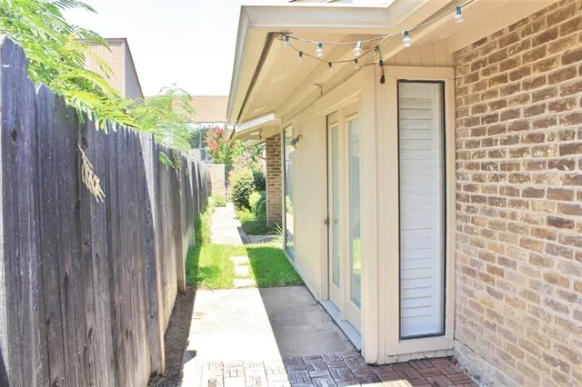 a view of a pathway of a house with wooden floor