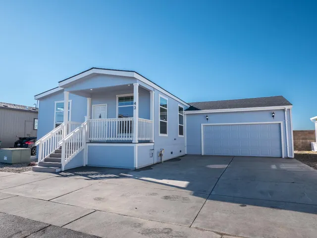 a front view of a house with a garage