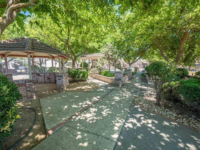 a view of a house with a tree in the background