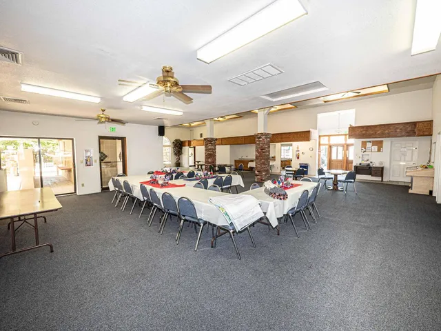a kitchen with stainless steel appliances granite countertop a sink dishwasher stove with cabinets and couches