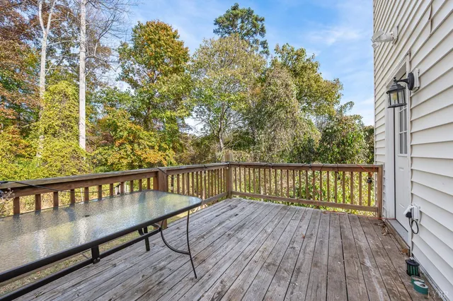 a view of balcony with wooden floor