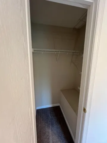 a view of a livingroom with a ceiling fan and window