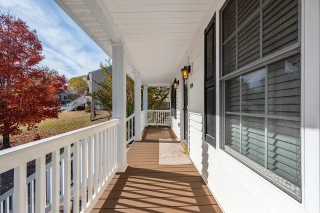 a view of a balcony with wooden floor