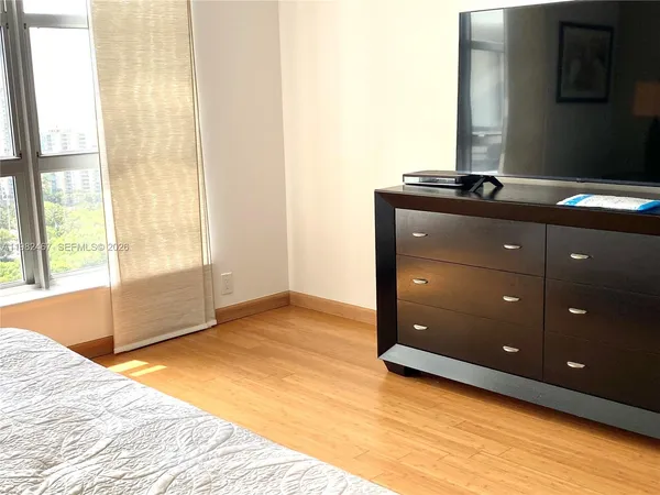 a bathroom with a shower and a toilet