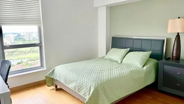 a view of a hallway with washer and dryer
