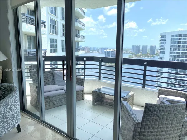 a living room with a large window and a couch