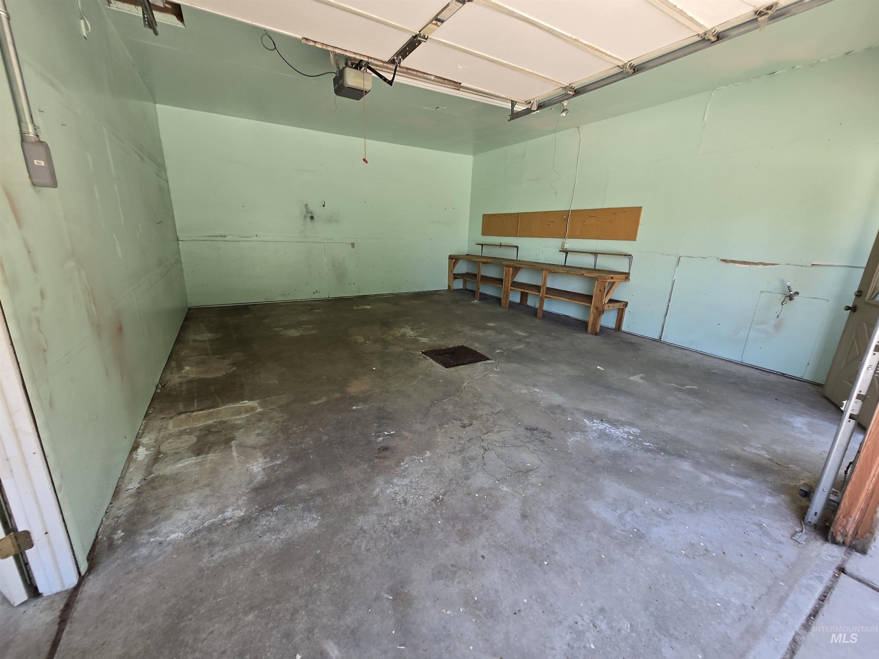 12050 West Hidden Valley Rim Road Boise, ID 83709 - Photo 26 of 39 Spacious garage with concrete flooring and light-toned painted walls