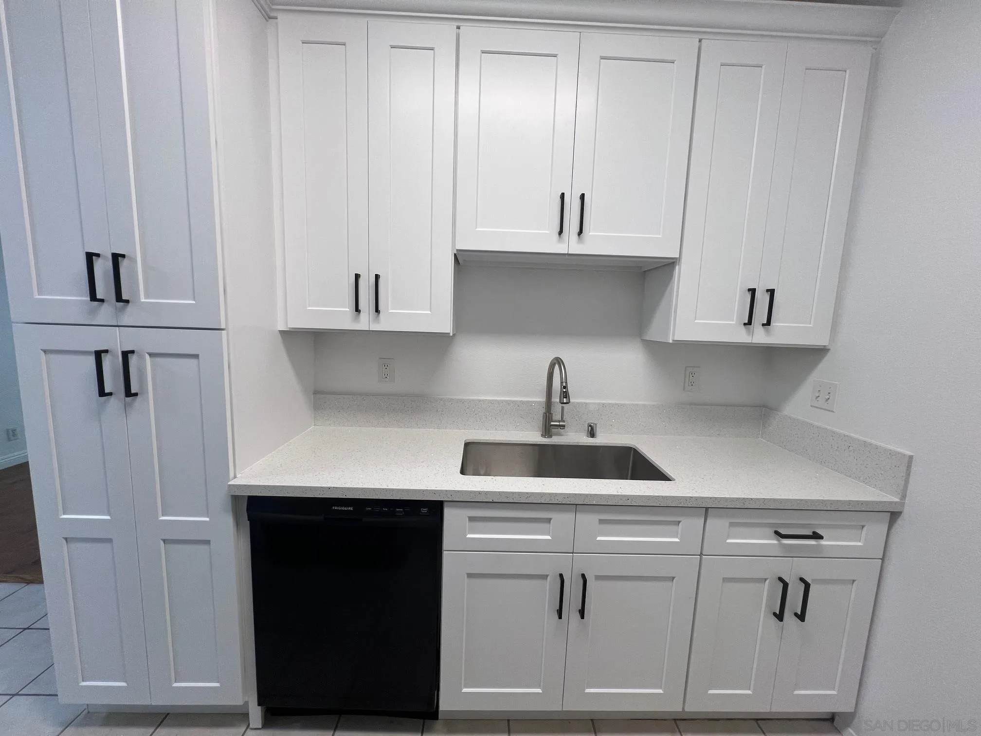8310 Regents Road, Unit 1E San Diego, CA 92122 - Photo 12 of 23 a kitchen with white cabinets and sink