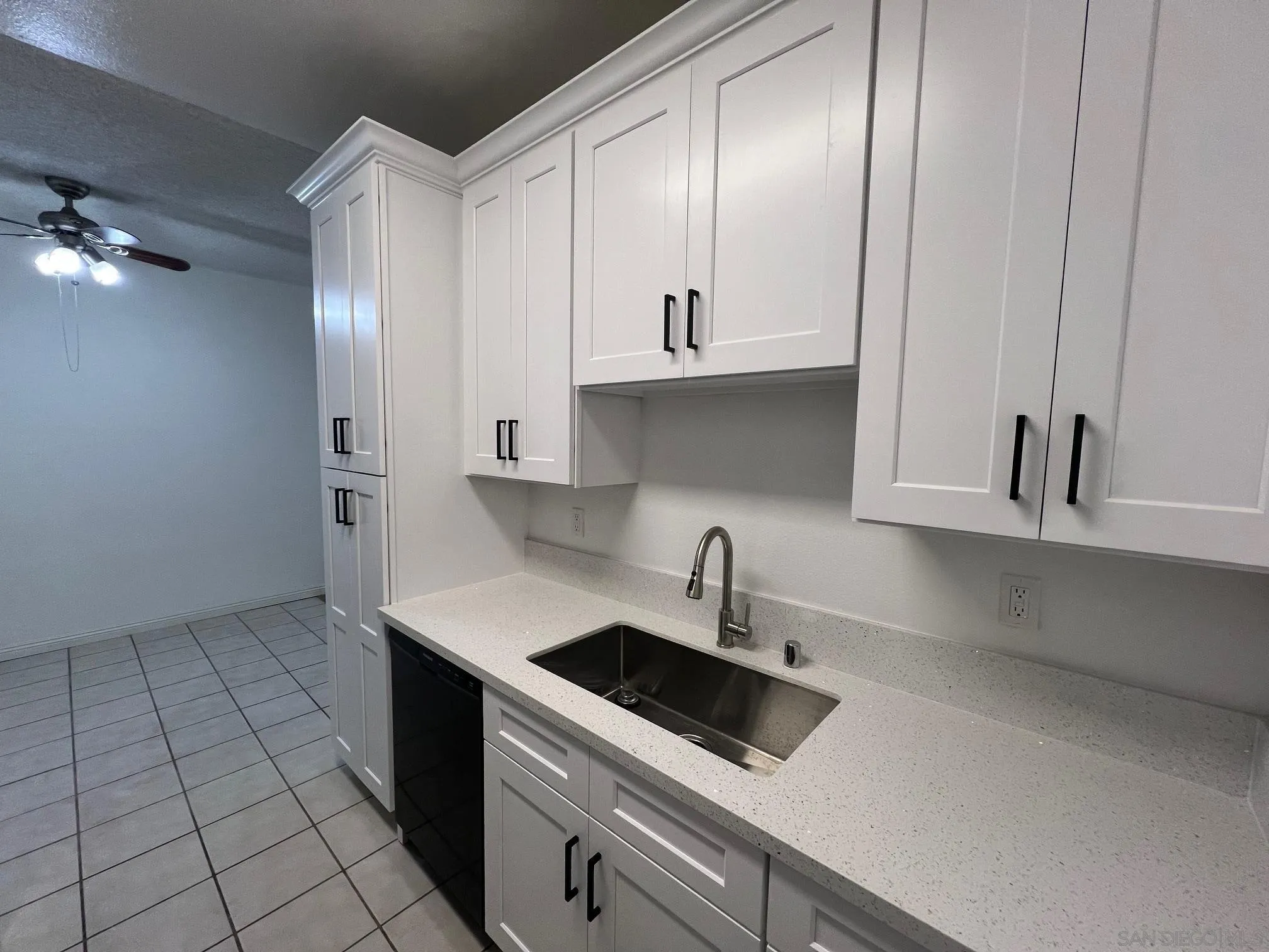 8310 Regents Road, Unit 1E San Diego, CA 92122 - Photo 13 of 23 a kitchen with a sink cabinets and appliances