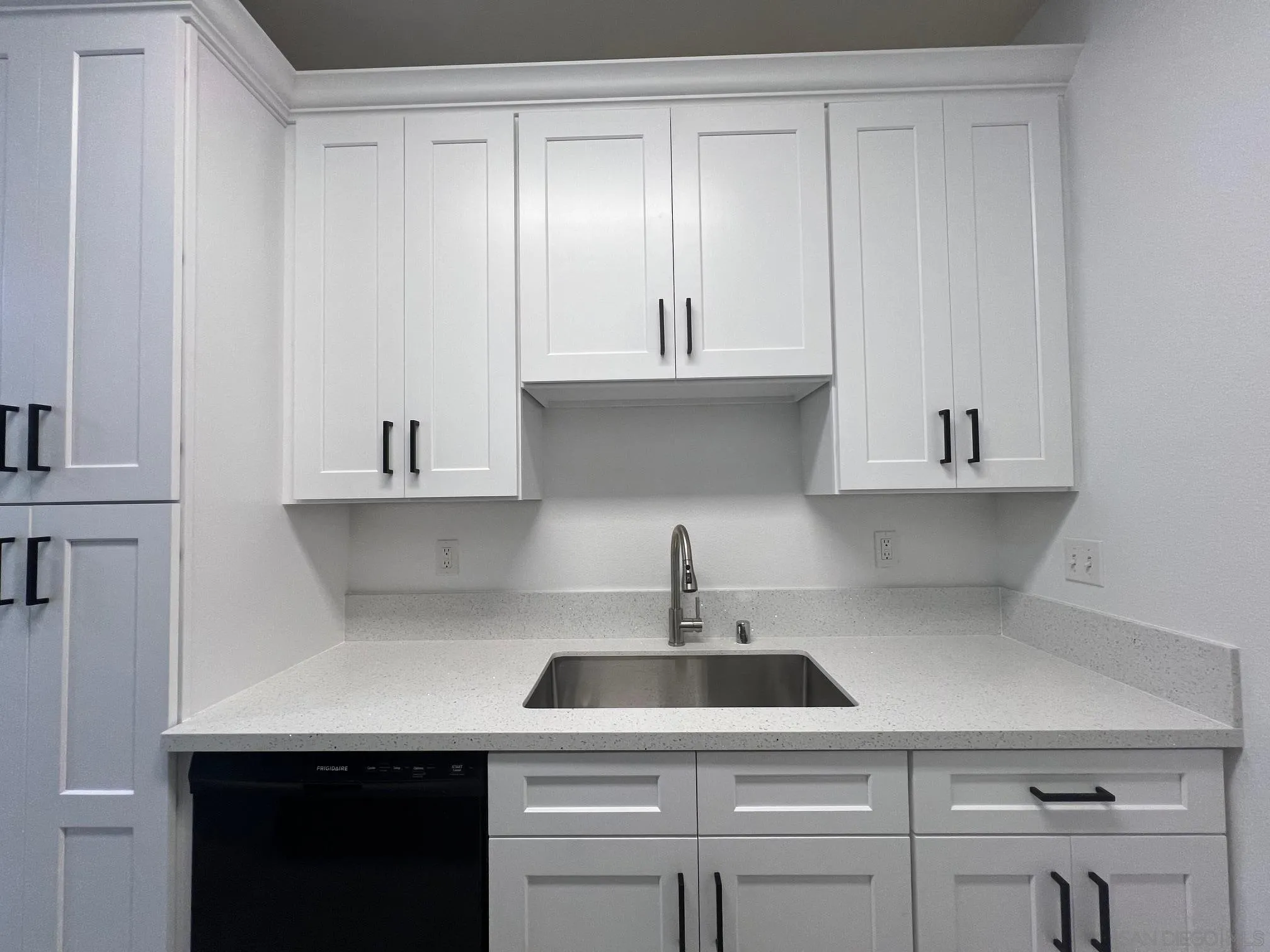 8310 Regents Road, Unit 1E San Diego, CA 92122 - Photo 14 of 23 a kitchen with a sink dishwasher and cabinets