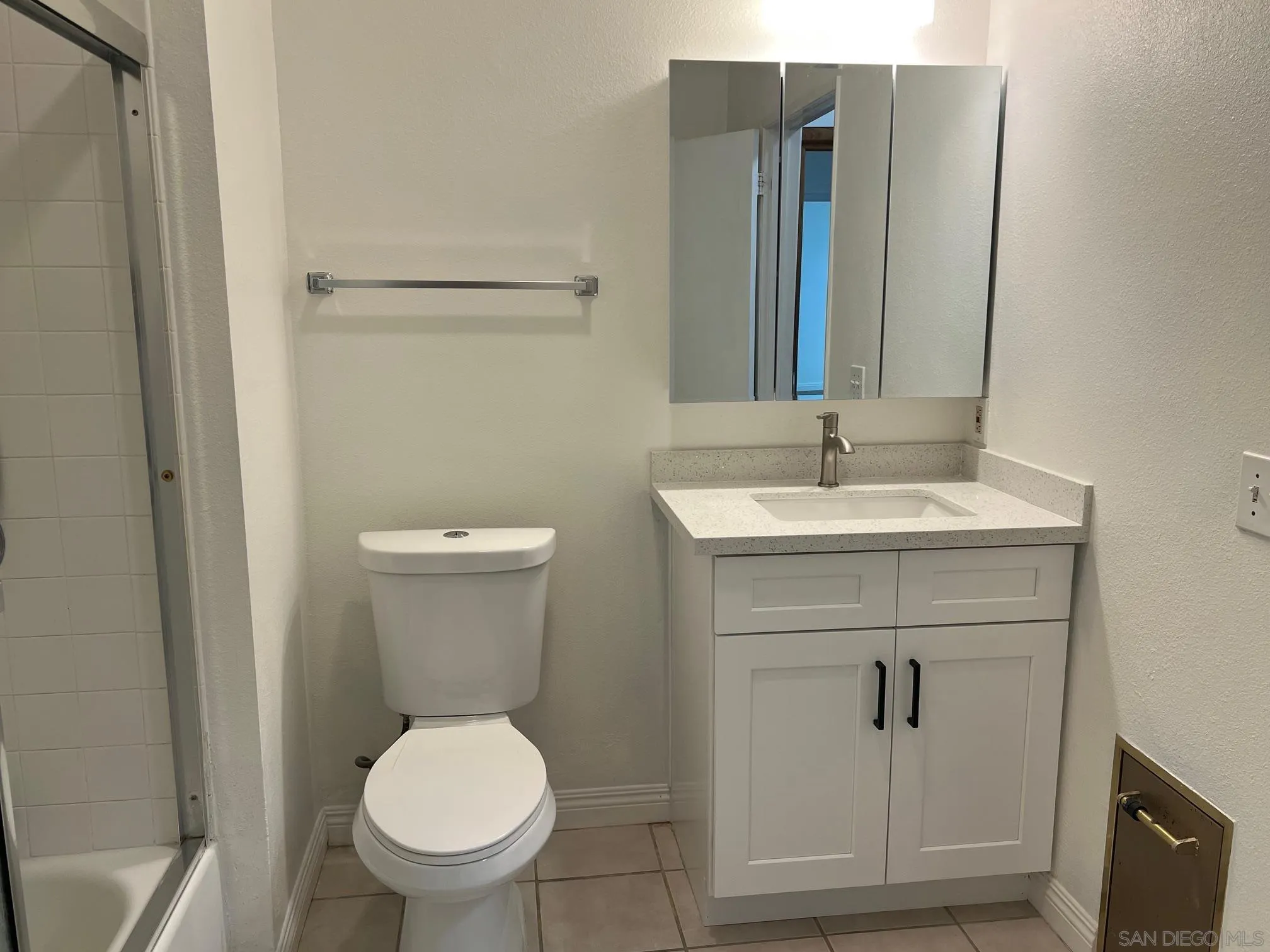 8310 Regents Road, Unit 1E San Diego, CA 92122 - Photo 16 of 23 a bathroom with a toilet sink and mirror
