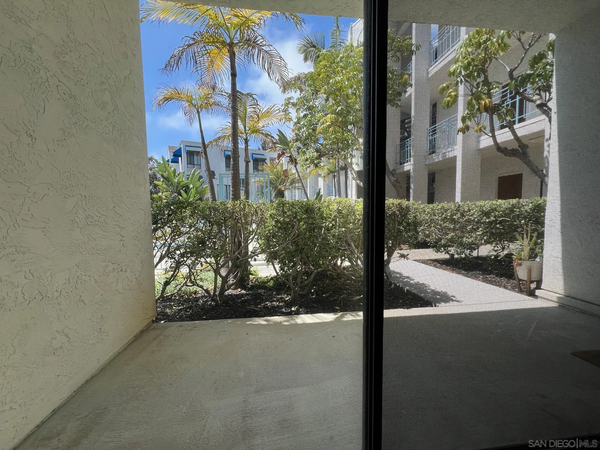 8310 Regents Road, Unit 1E San Diego, CA 92122 - Photo 17 of 23 a view of a entrance gate of the house and trees