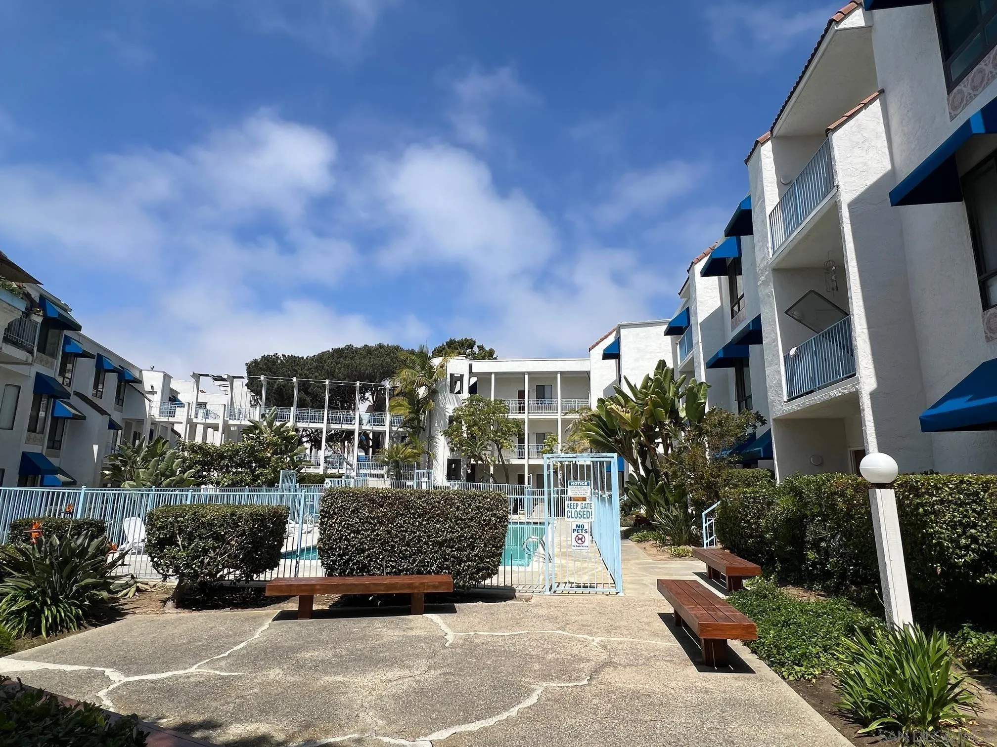 8310 Regents Road, Unit 1E San Diego, CA 92122 - Photo 2 of 23 a view of a building and car parked