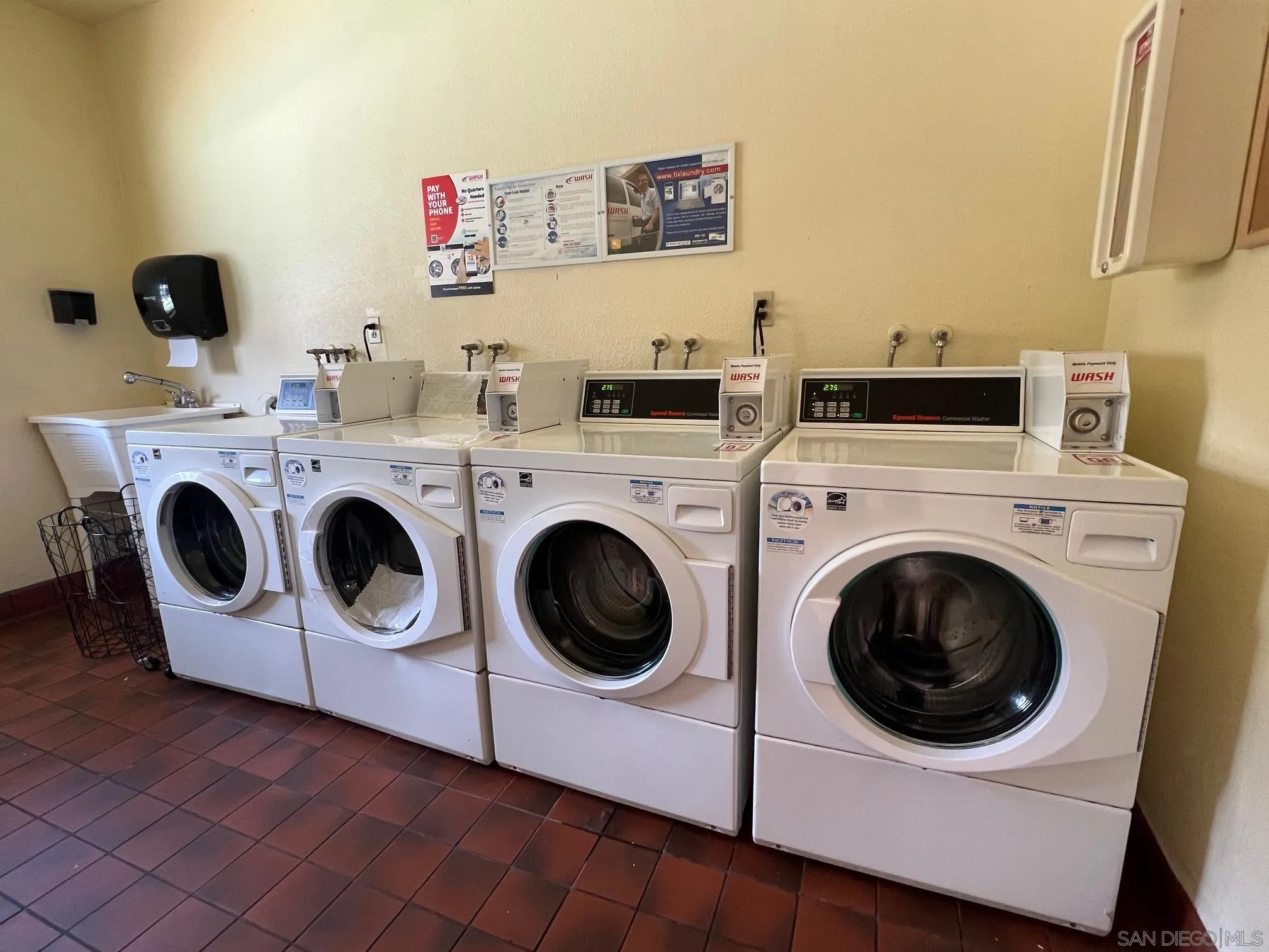 8310 Regents Road, Unit 1E San Diego, CA 92122 - Photo 23 of 23 a utility room with dryer and washer