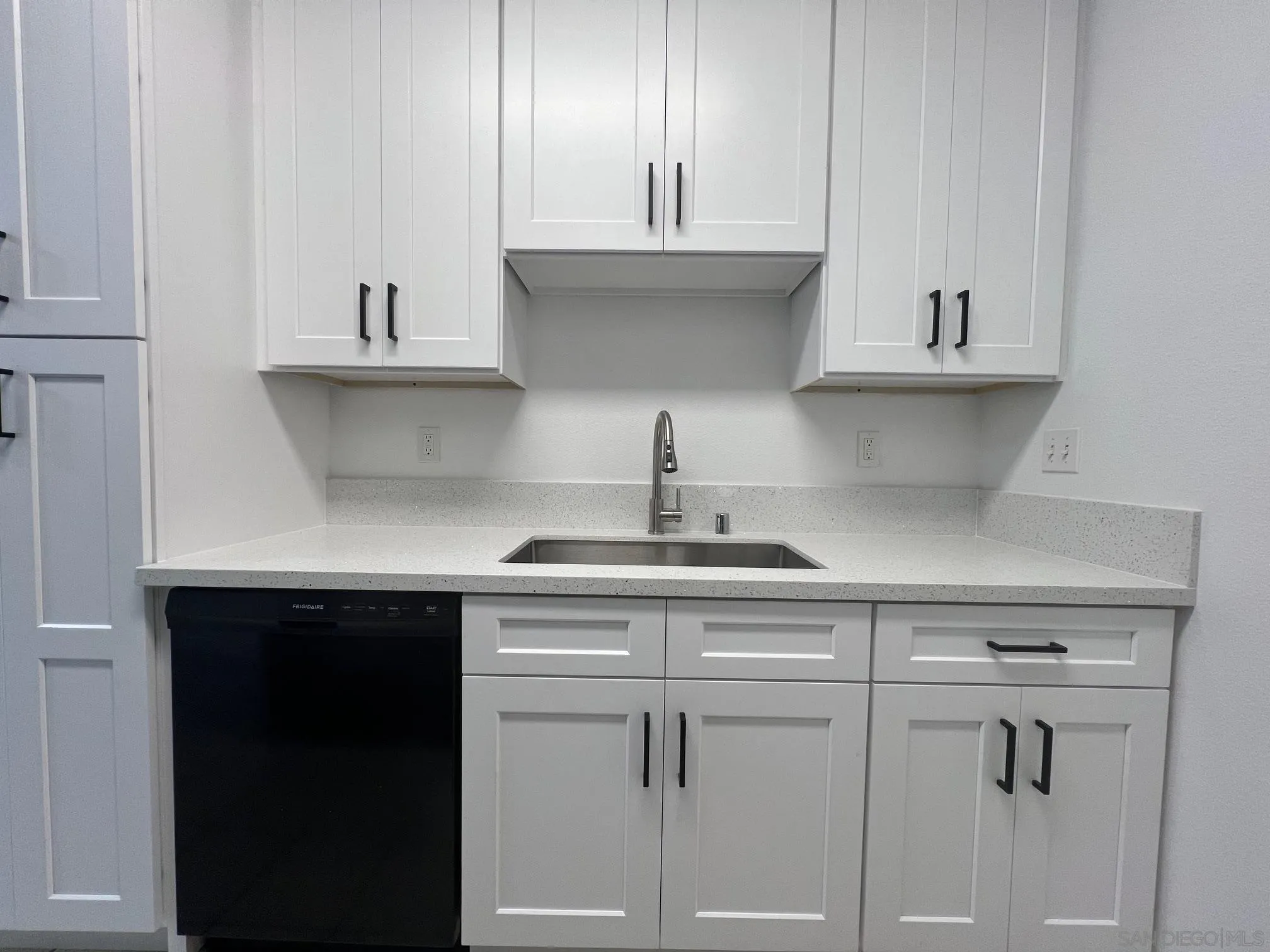 8310 Regents Road, Unit 1E San Diego, CA 92122 - Photo 10 of 23 a kitchen with white cabinets and a sink