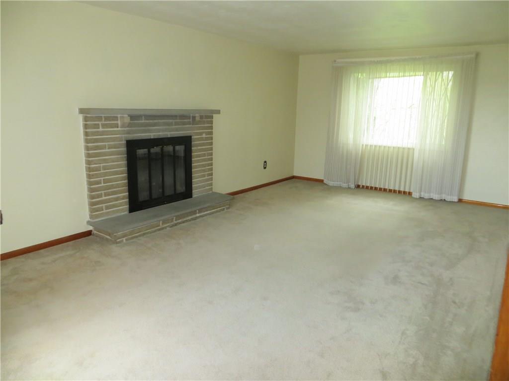 115 Porter Lane Rochester, PA 15074 - Photo 5 of 11 Living room with Log Brick Fireplace