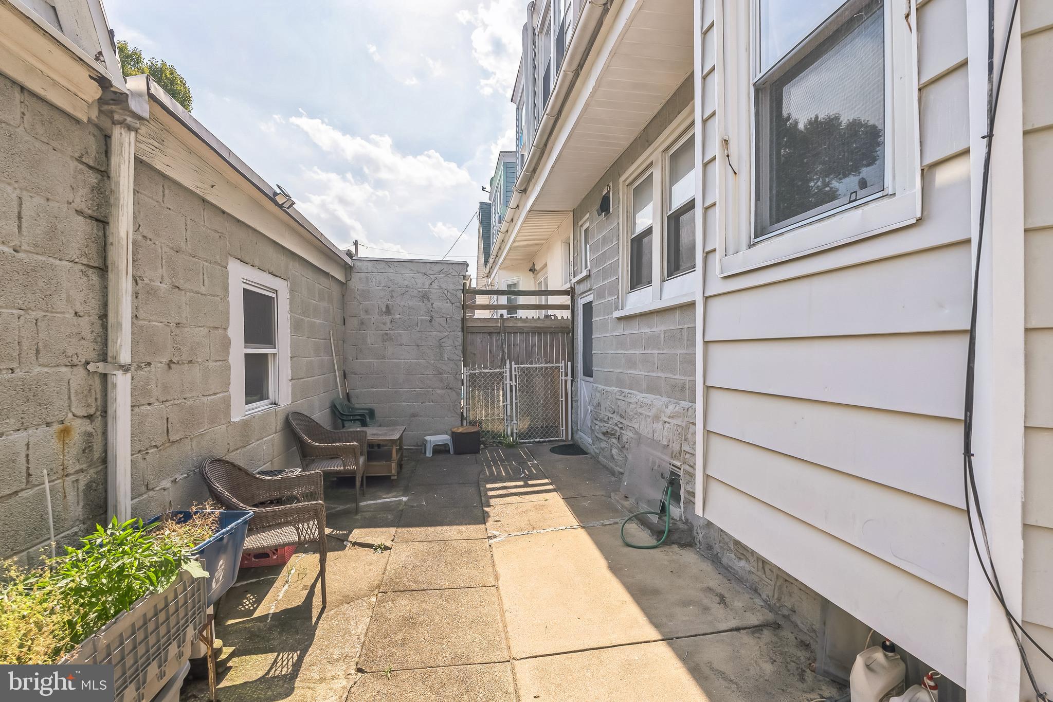 134 Heather Road Upper Darby, PA 19082 - Photo 27 of 30 a view of a patio with couches chairs and potted plants