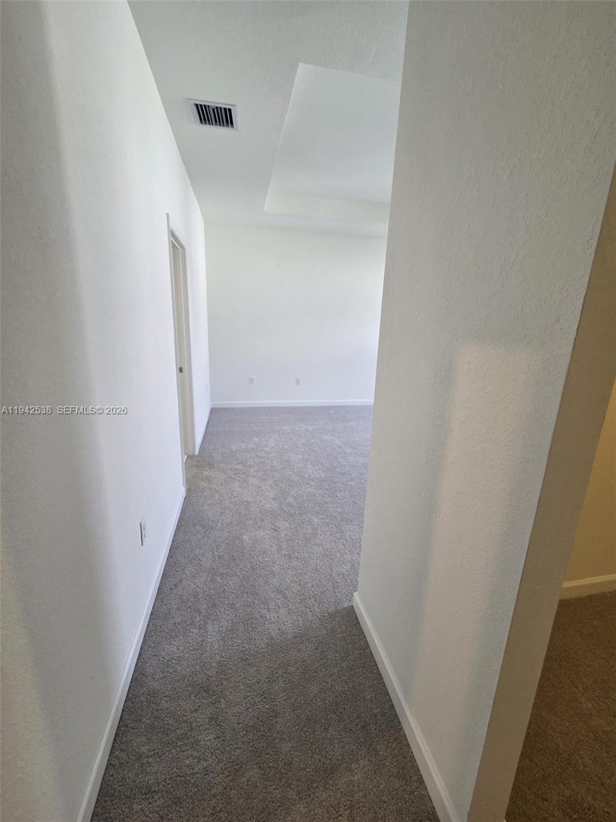 16303 Southwest 147th Place, Unit 16303 Miami, FL 33193 - Photo 14 of 37 a view of a hallway