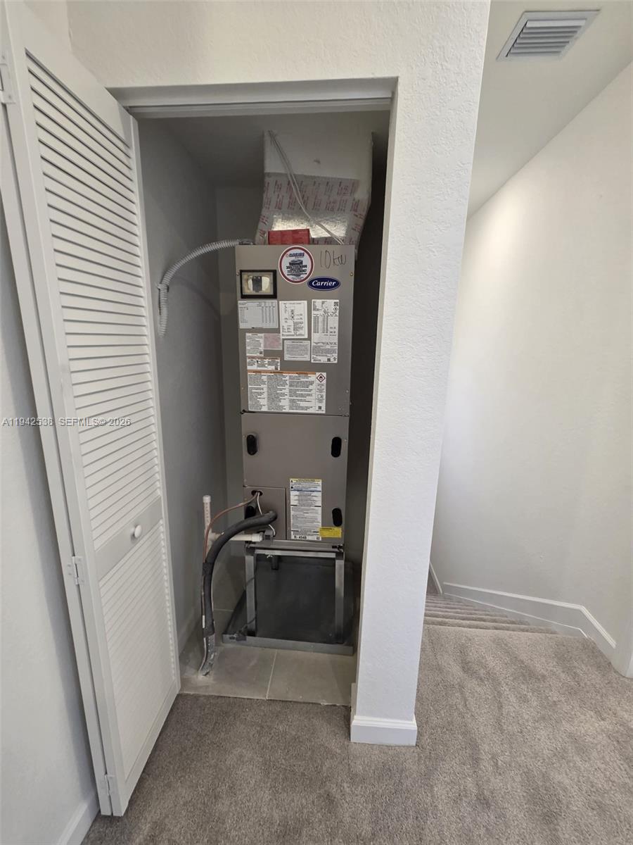 16303 Southwest 147th Place, Unit 16303 Miami, FL 33193 - Photo 22 of 37 a workspace with furniture and a window