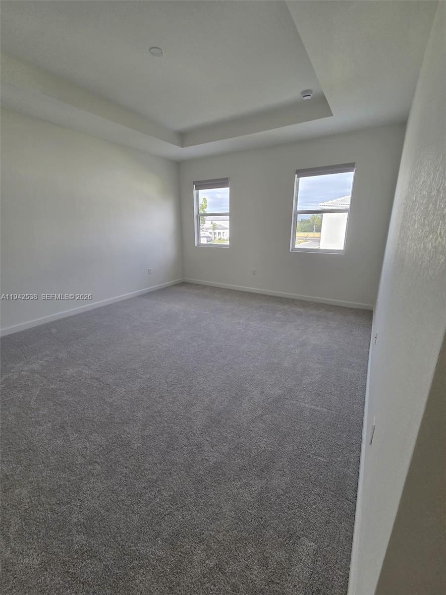 16303 Southwest 147th Place, Unit 16303 Miami, FL 33193 - Photo 27 of 37 an empty room with a window