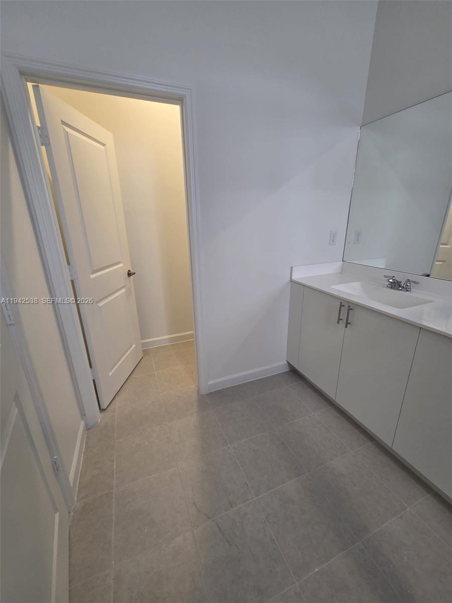 16303 Southwest 147th Place, Unit 16303 Miami, FL 33193 - Photo 31 of 37 a view of storage and utility room with a sink