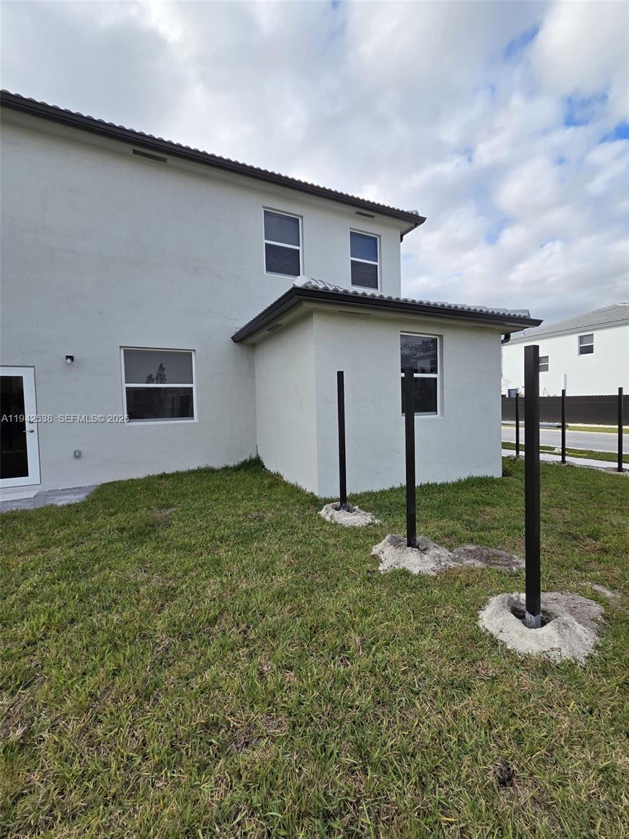 16303 Southwest 147th Place, Unit 16303 Miami, FL 33193 - Photo 34 of 37 a front view of house with yard