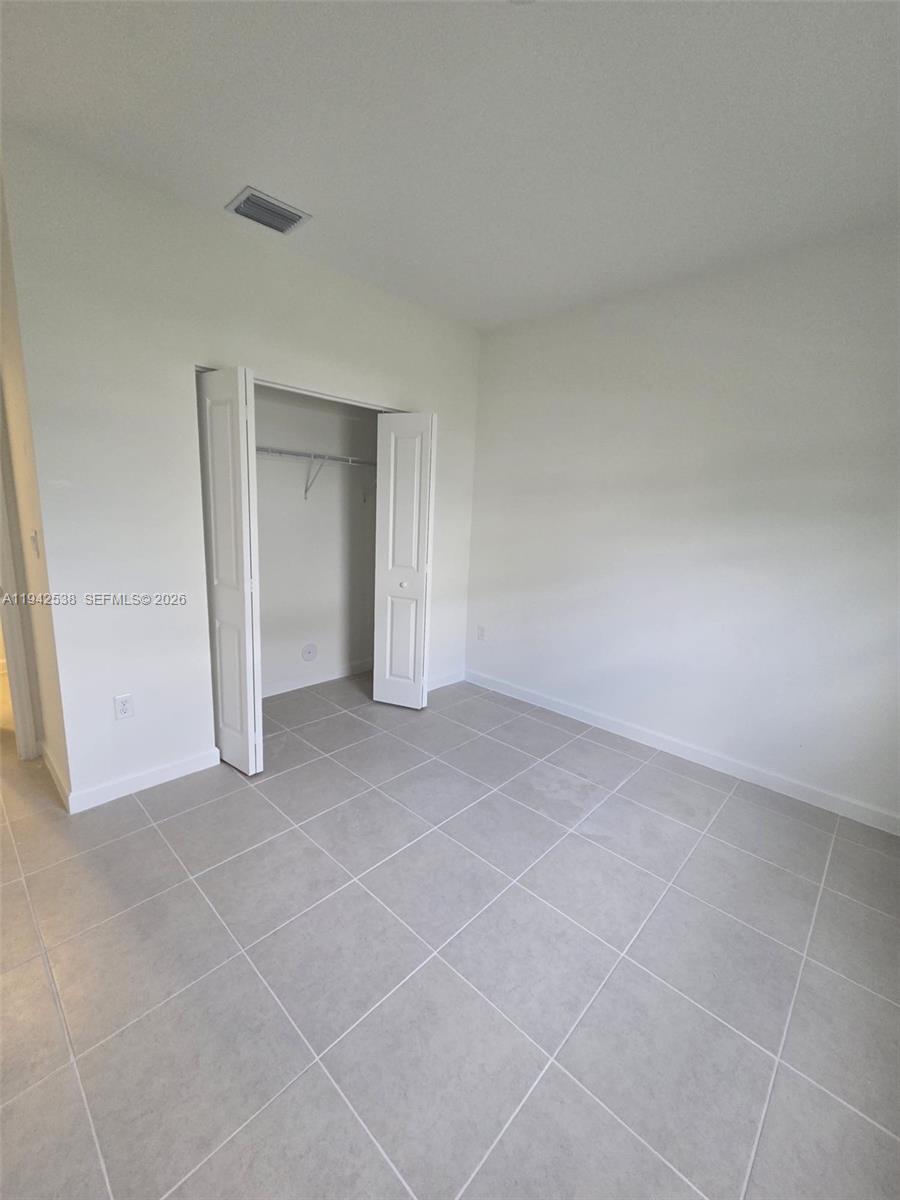 16303 Southwest 147th Place, Unit 16303 Miami, FL 33193 - Photo 36 of 37 a view of an empty room