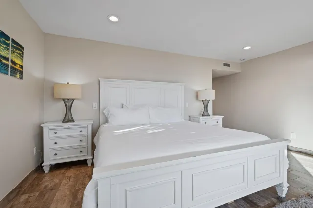 a bedroom with a bed and a dresser