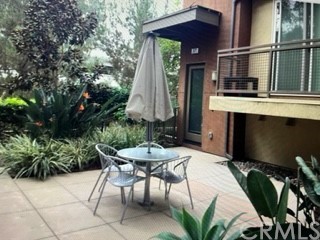 571 Rockefeller Irvine, CA 92612 - Photo 1 of 1 a backyard of a house with barbeque oven table and chairs