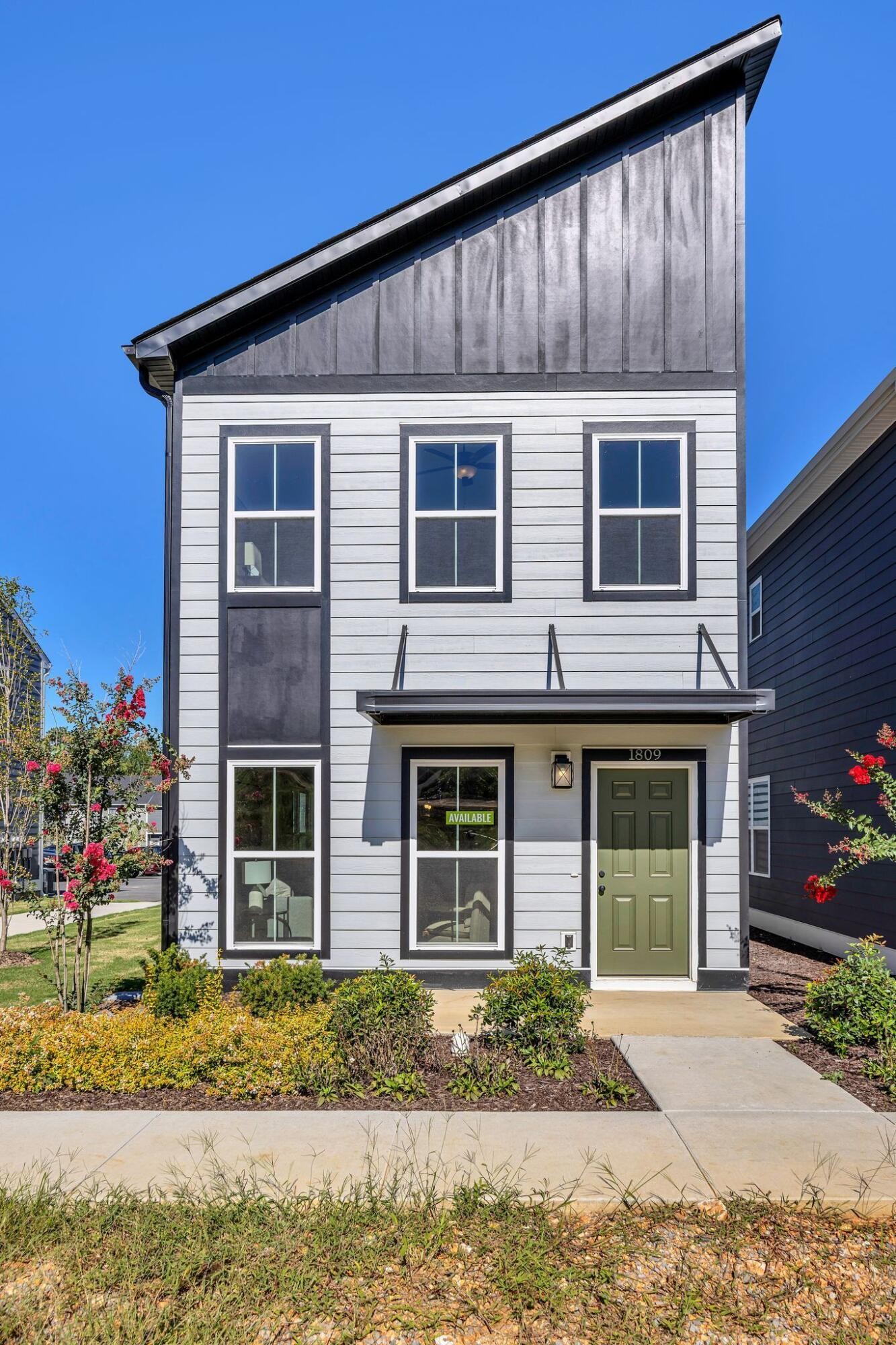 1809 Cotton Way Chattanooga, TN 37404 - Photo 1 of 27 a front view of a house with a garden and plants