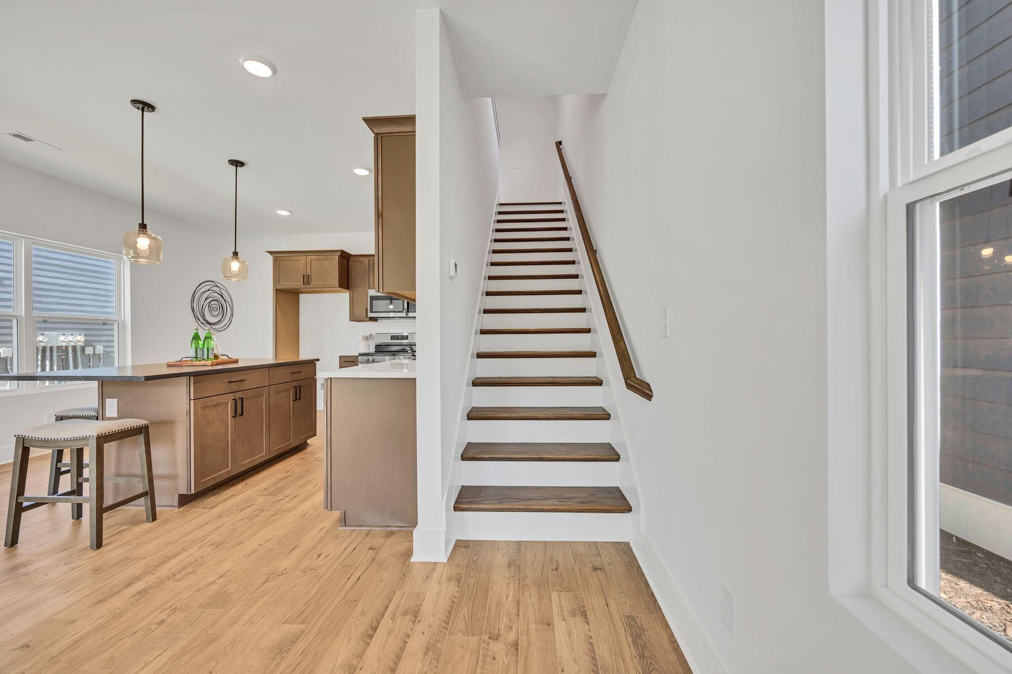 1809 Cotton Way Chattanooga, TN 37404 - Photo 13 of 27 a kitchen with wooden floors and white cabinets