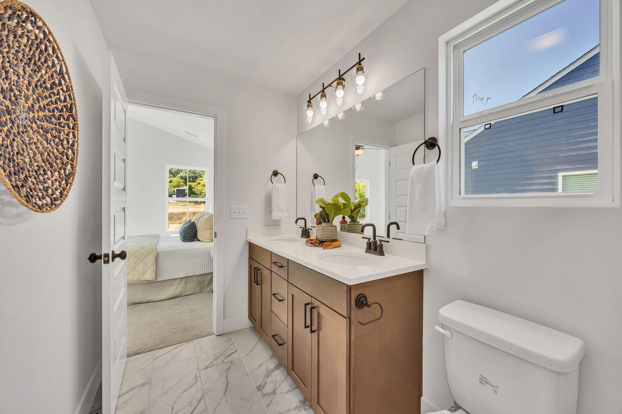 1809 Cotton Way Chattanooga, TN 37404 - Photo 20 of 27 a bathroom with a sink a toilet and mirror