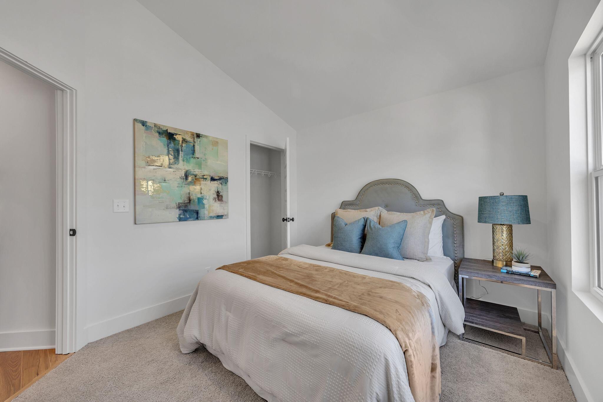 1809 Cotton Way Chattanooga, TN 37404 - Photo 25 of 27 a bedroom with a bed and a painting on the wall