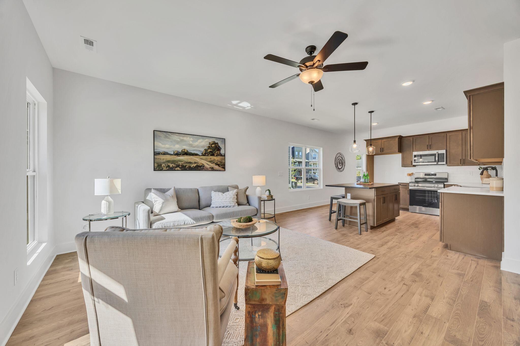1809 Cotton Way Chattanooga, TN 37404 - Photo 5 of 27 a living room with stainless steel appliances kitchen island granite countertop furniture a rug kitchen view and a chandelier
