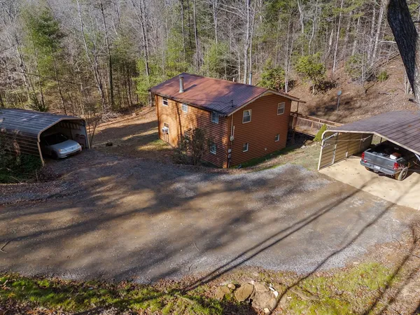 a view of a backyard with side of the street