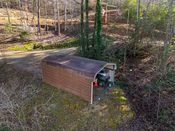 an aerial view of house with yard and mountain view