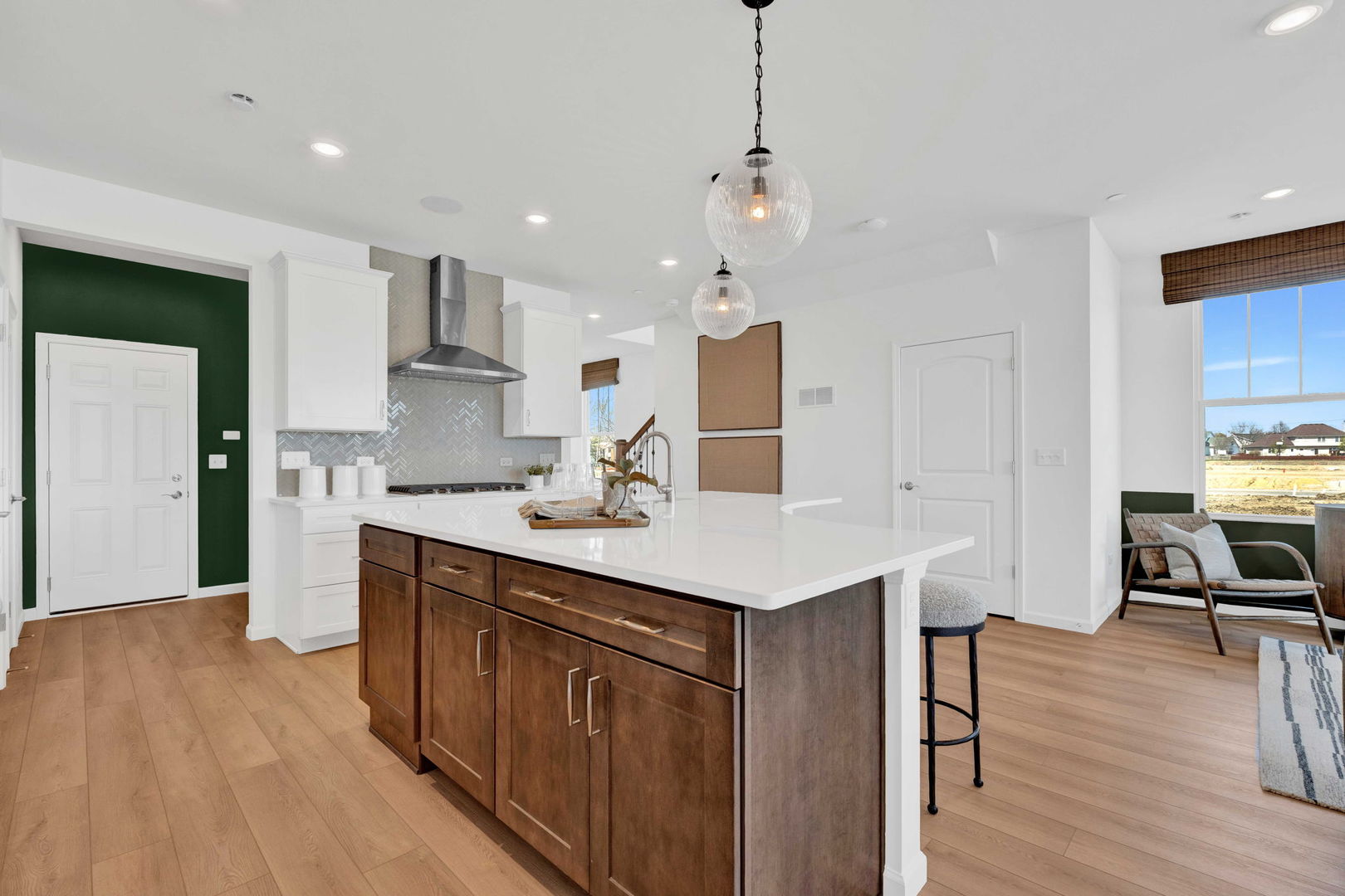 57 Weirich Way, Unit 78001 Batavia, IL 60510 - Photo 7 of 22 a kitchen with kitchen island a sink stainless steel appliances and wooden floor