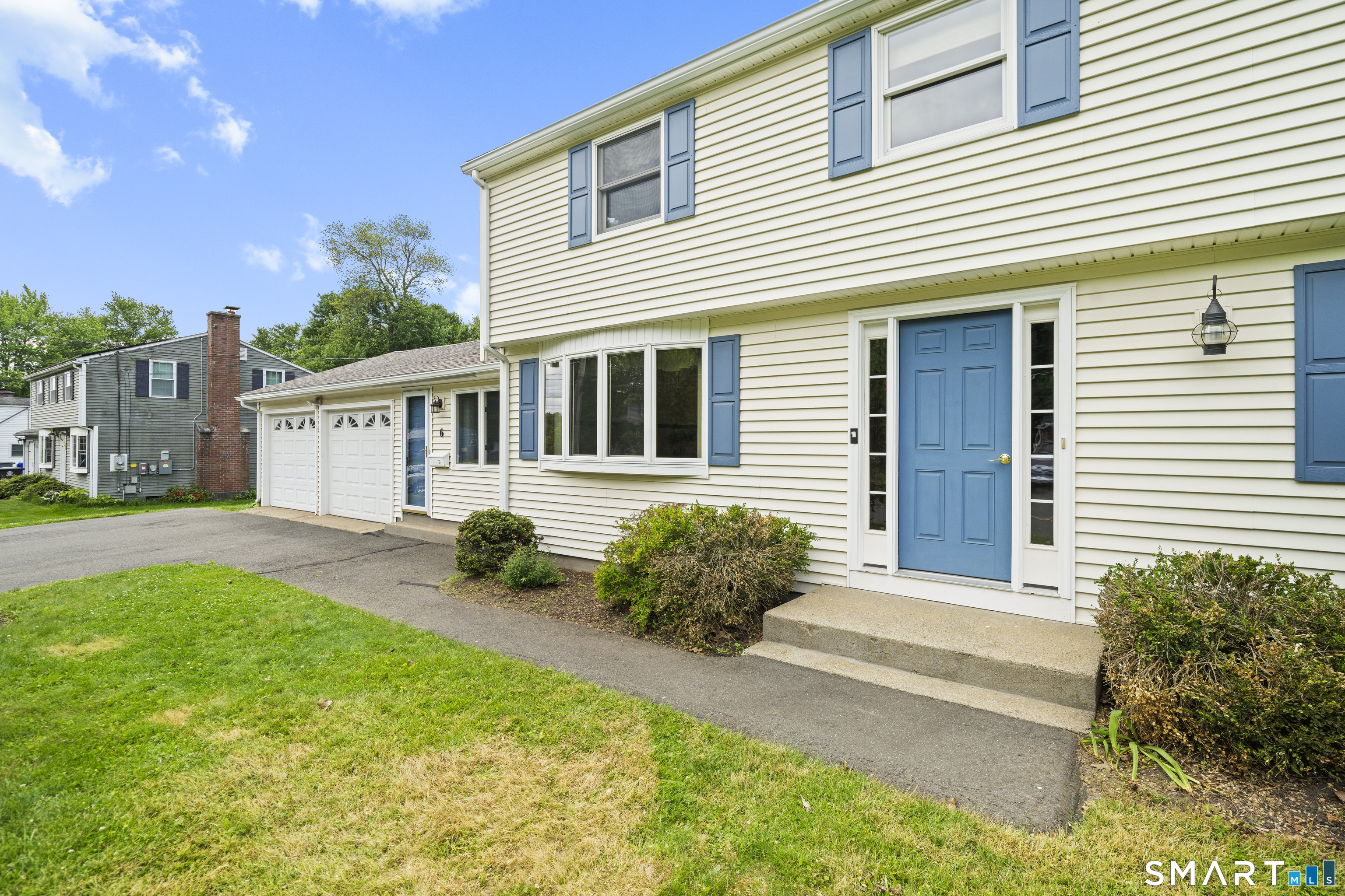 6 Cartier Road Enfield, CT 06082 - Photo 35 of 40 a front view of a house with garden