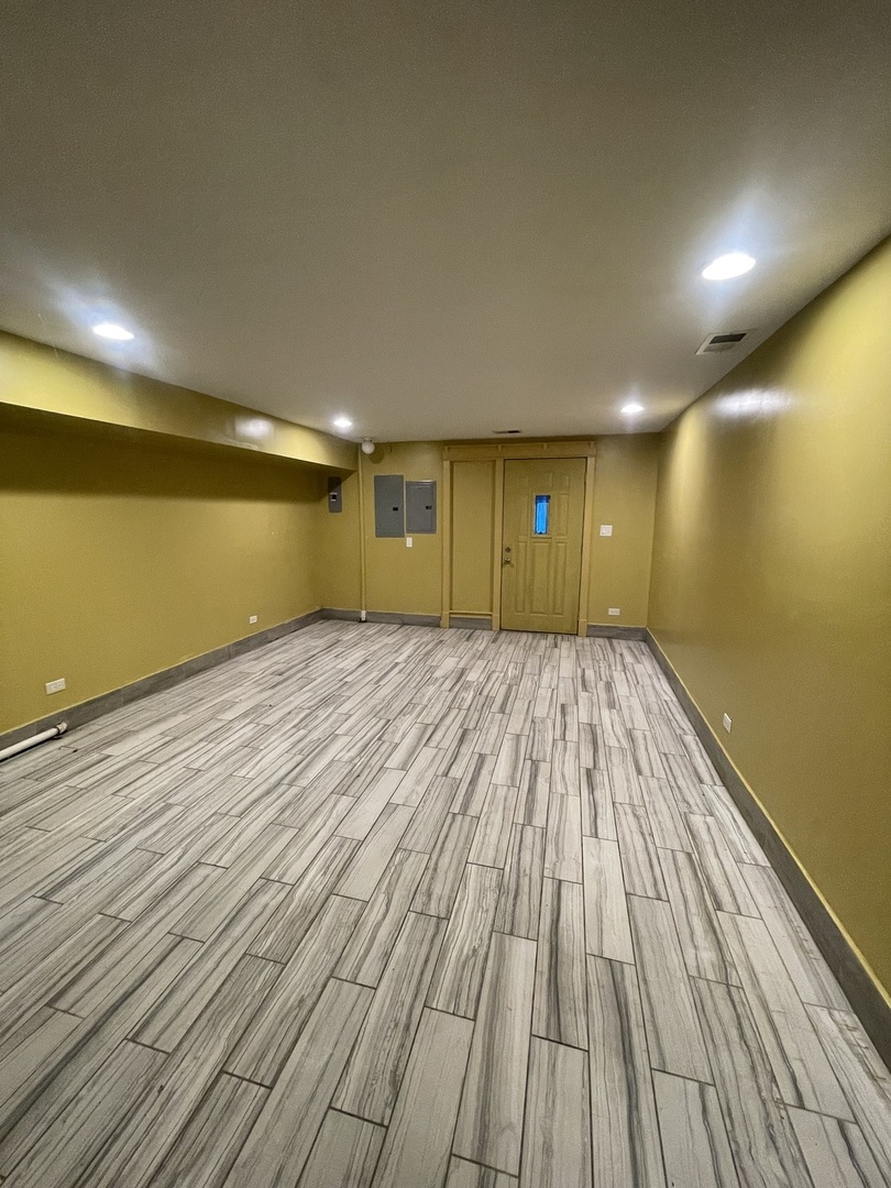 3341 West Walnut Street, Unit 1 Chicago, IL 60624 - Photo 9 of 10 a view of empty room with wooden floor