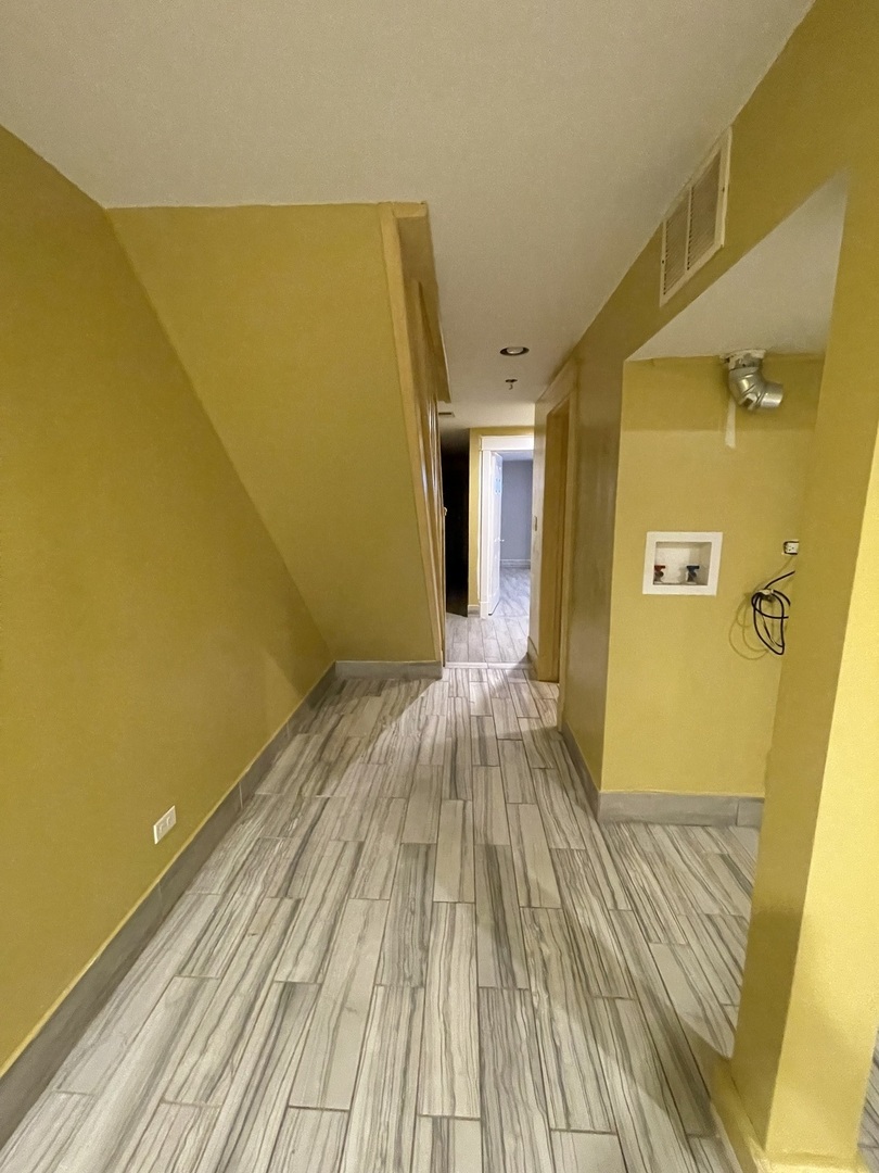 3341 West Walnut Street, Unit 1 Chicago, IL 60624 - Photo 10 of 10 a view of a room with wooden floor