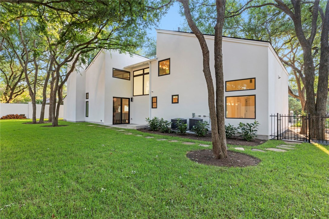 7801 Ridgestone Drive Austin, TX 78731 - Photo 1 of 1 a front view of house with yard and green space
