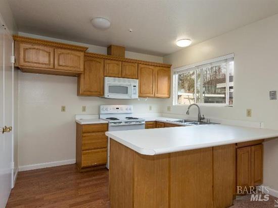2900 Yulupa Avenue Santa Rosa, CA 95405 - Photo 8 of 11 a kitchen with stainless steel appliances granite countertop a sink stove microwave and cabinets