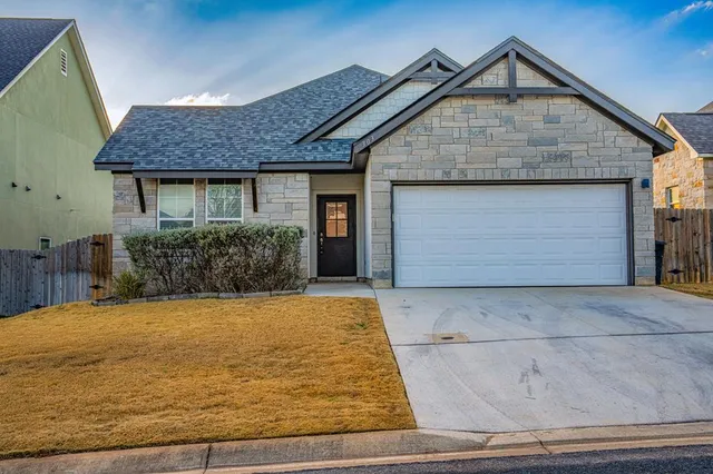 a front view of house a yard