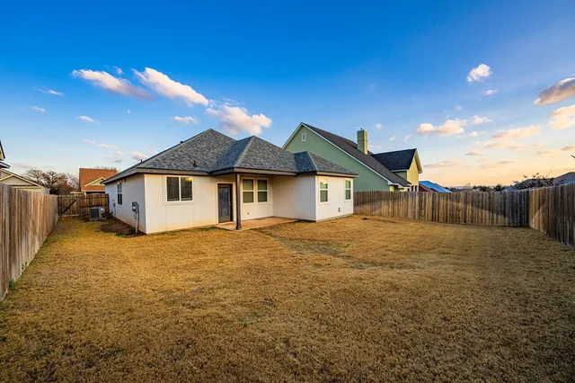 a house view with a backyard space