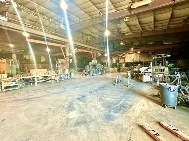 a view of a swimming pool with outdoor seating