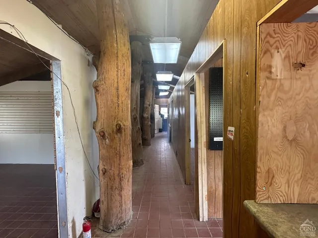 a view of a street with houses in the back