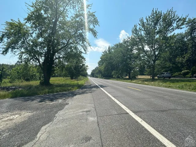 a view of a road with a trees